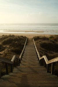 Pier over sea against sky