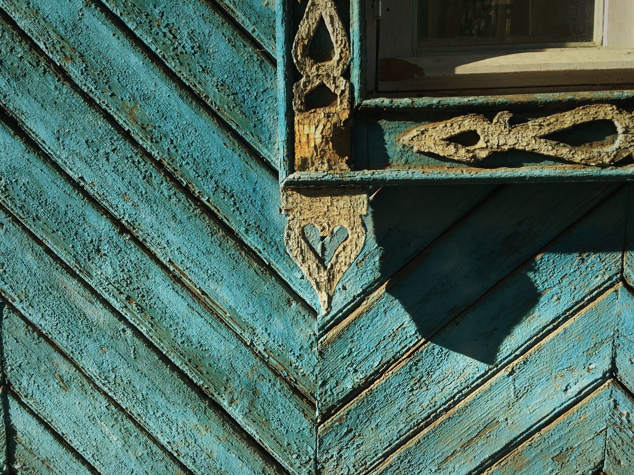 LOW ANGLE VIEW OF METAL DOOR ON OLD WALL