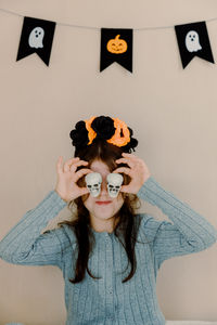 Portrait of woman holding heart