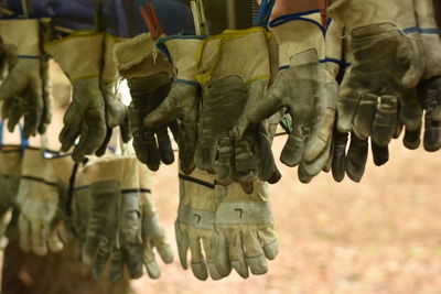 Protective gloves hanging for sale at market