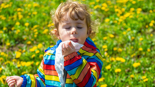 Portrait of cute girl standing against plants