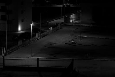 High angle view of illuminated parking lot at night