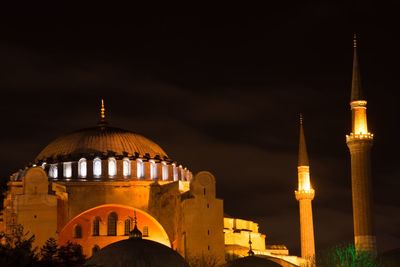 Illuminated cathedral against sky at night