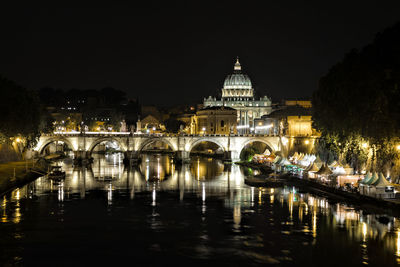 Arch bridge over river in city