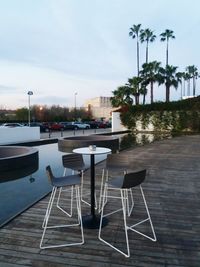 Empty chairs against the sky