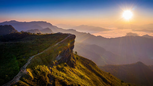 Scenic view of mountains against sky during sunset