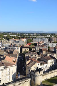 High angle view of cityscape against clear blue sky