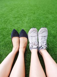 Low section of women legs on grass