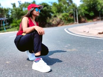 Woman  on road in city.