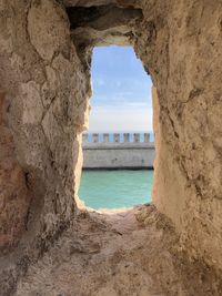 Sea seen through arch window