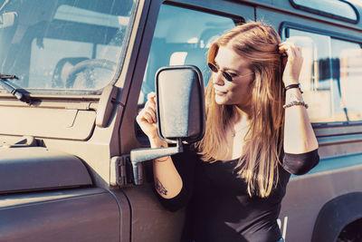 Young woman in car