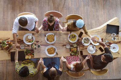 High angle view of people on table