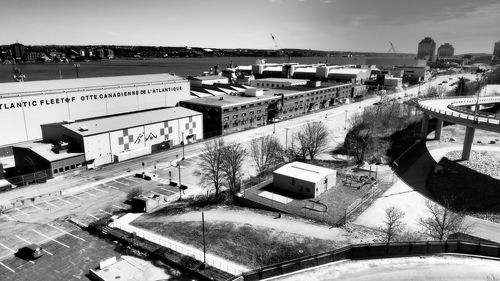 High angle view of road by buildings against sky