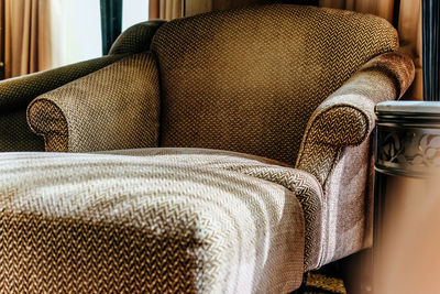 Close-up of sofa on chair at home