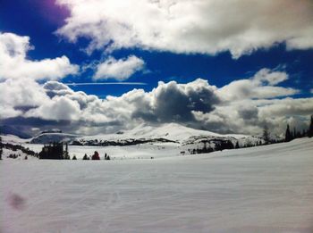 Scenic view of snow covered field