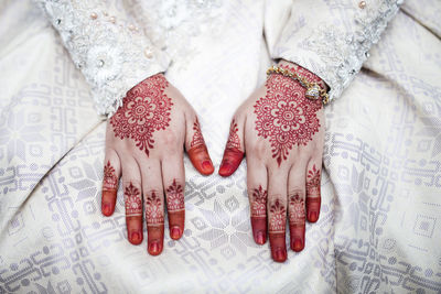 High angle view of bride with henna tattoo