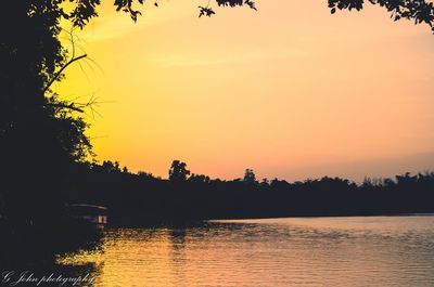 Scenic view of silhouette trees against sky during sunset