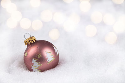 Close-up of christmas ornaments on fabric