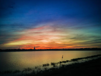 Scenic view of lake during sunset