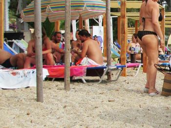 Men sitting on chair at beach