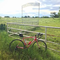 Bicycle on field against sky