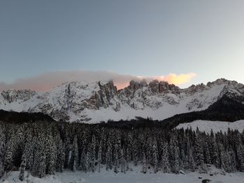 Scenic view of snow covered mountains against sky