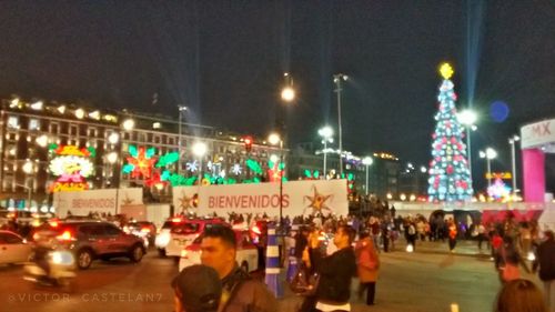 People on city street at night