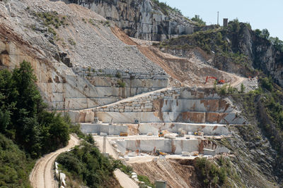 View of the carrara marble quarries with excavation equipment ready for work.