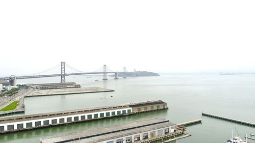 View of bridge over sea against clear sky