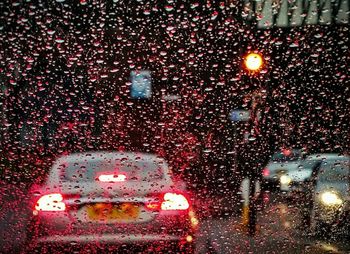 Rain drops on road at night