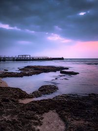 Scenic view of sea against sky at sunset