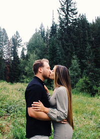 Young couple standing in forest