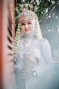 Portrait of young woman looking at camera