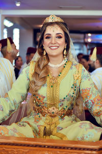 Portrait of smiling young woman in traditional clothing