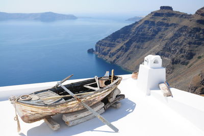 Old wooden boat on building terrace