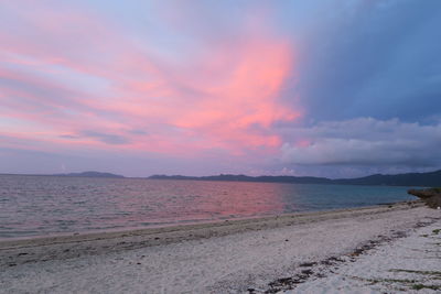 Scenic view of beach against sky during sunset