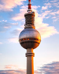 Low angle view of tower against sky during sunset