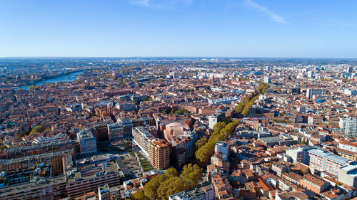 High angle view of cityscape against clear blue sky