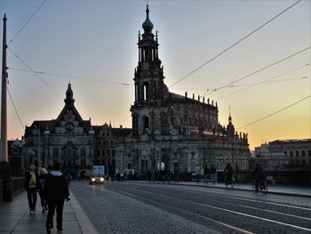 View of buildings in city at sunset