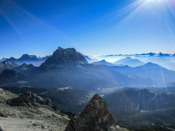 Scenic view of mountains against clear blue sky