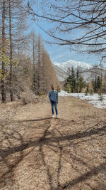 Rear view of man standing on field