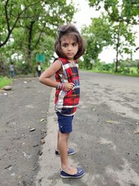 Portrait of cute girl standing outdoors