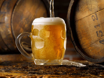 Close-up of beer glass on table