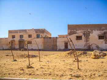 Buildings in city against clear sky