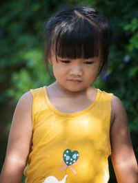 Portrait of cute boy standing outdoors