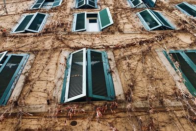 Low angle view of window on old building