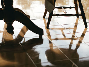 Low section of woman standing on floor