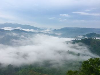 Scenic view of mountains with fog