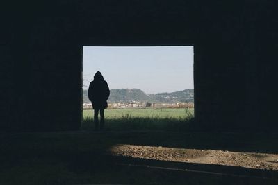 Full length of woman standing on landscape