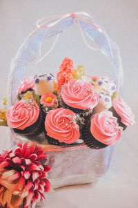 Bouquet of cupcake and marshmallows in basket. a gift on valentines day, birthday and anniversary.